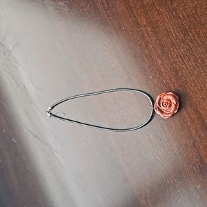 Leather necklace with red rose charm